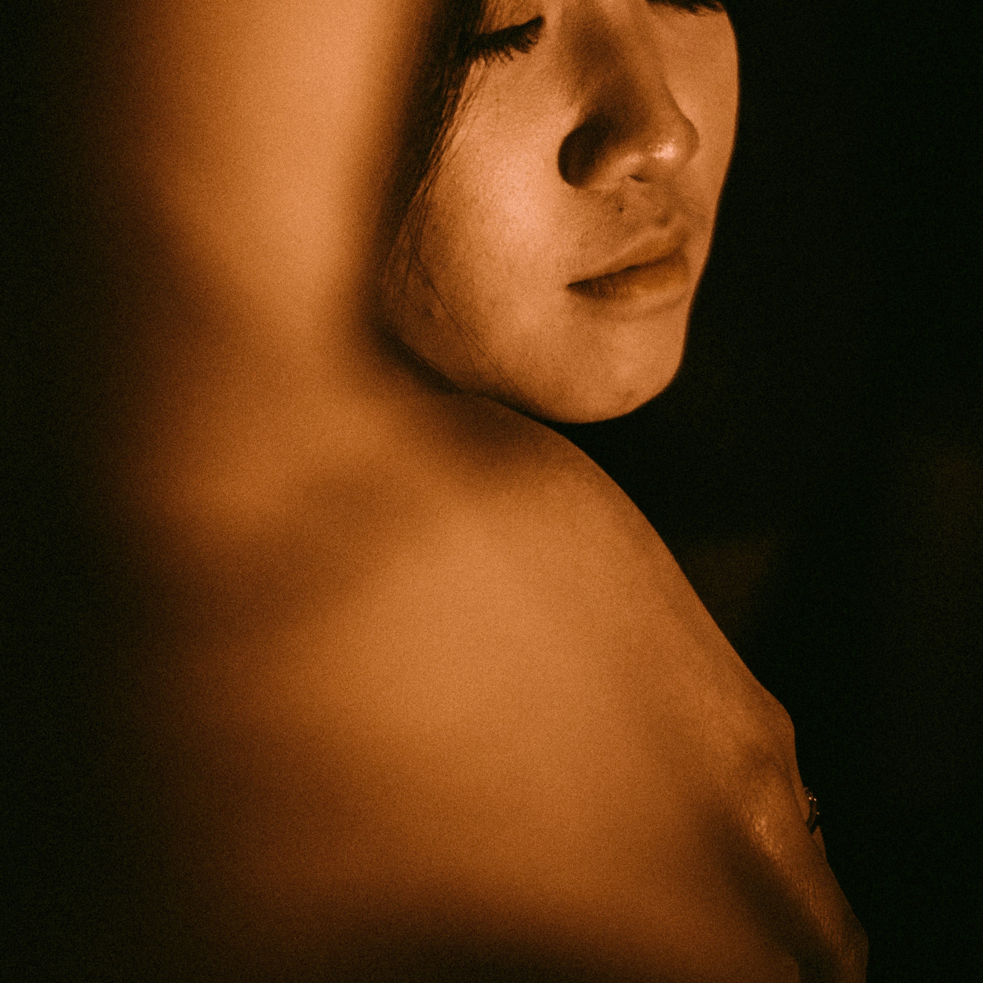 women with closed eyes in studio background