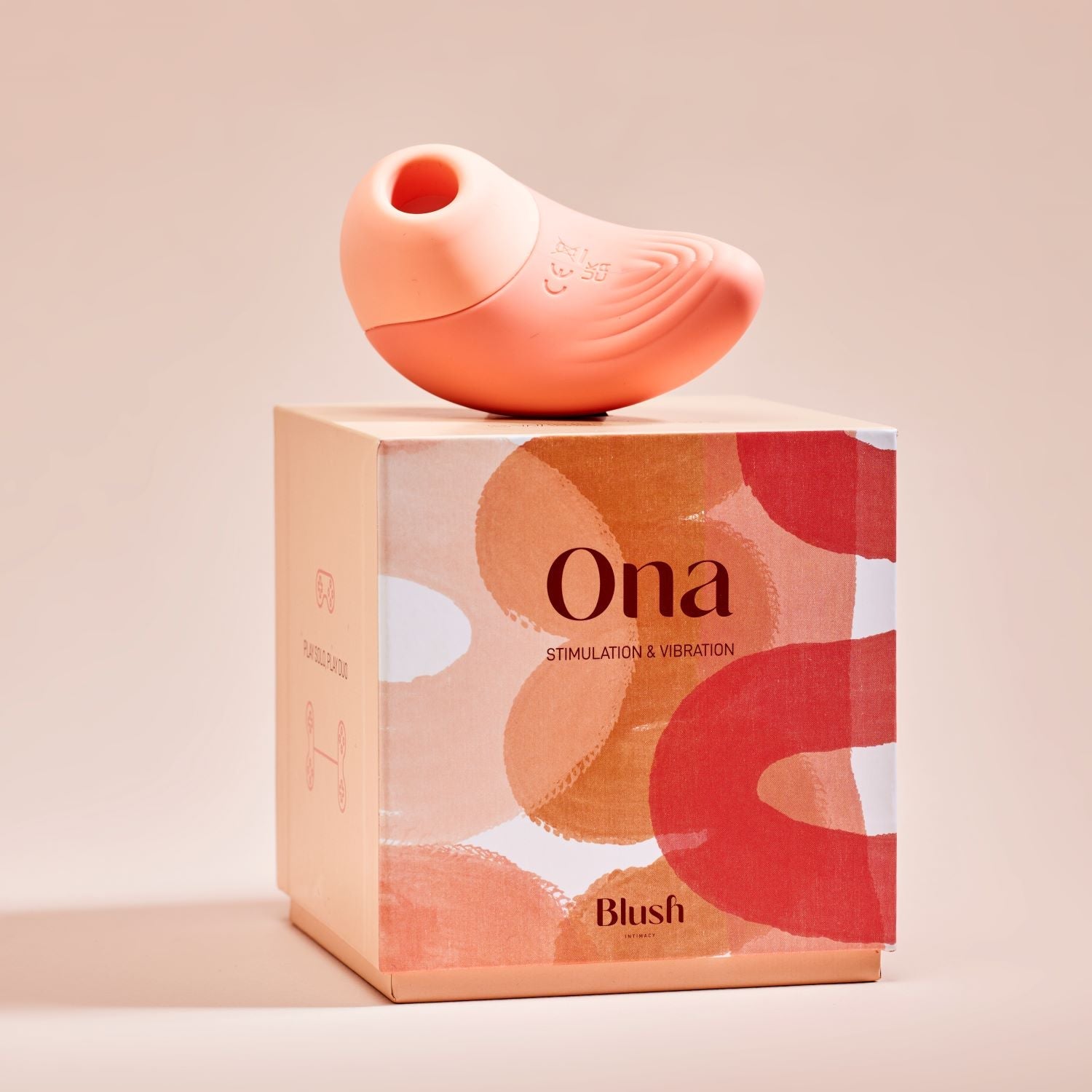 This is a photo of Ona, Bouche Bée's vibrating clitoral stimulator, with packaging.