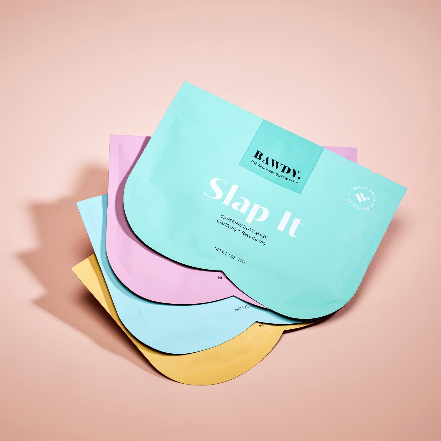 C'est une photo du butt mask collection de Bawdy, jaune, bleu vert rose packaging